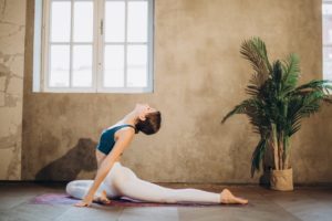 woman-practicing-yoga-backbend-3822138